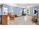 Cozy living area showcasing tile floors, a neutral color palette, and abundant natural light at 4552 Cr 300, Lake Panasoffkee, FL 33538