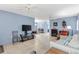 Comfortable living room with tile floors, ceiling fans, and neutral decor at 4552 Cr 300, Lake Panasoffkee, FL 33538