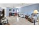 Open living room featuring tile flooring, neutral paint, ceiling fans, and comfortable furnishings at 4552 Cr 300, Lake Panasoffkee, FL 33538