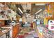 The well-lit shed interior features extensive storage and workspace at 4552 Cr 300, Lake Panasoffkee, FL 33538