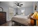 Charming bedroom with hardwood floors, soft lighting, and dresser creating a warm, inviting atmosphere at 50 Pecan Run Crse, Ocala, FL 34472