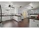 Bright kitchen with white cabinets, contrasting wood countertops, and an open layout with modern features at 50 Pecan Run Crse, Ocala, FL 34472