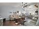 Inviting living room featuring cozy seating, dark floors and an open layout perfect for entertaining guests at 50 Pecan Run Crse, Ocala, FL 34472