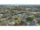 An extensive aerial view shows a residential neighborhood shaded with lots of trees at 516 Spring Oaks Blvd, Altamonte Springs, FL 32714