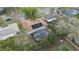 Aerial view of a house with solar panels on the roof and an enclosed pool in the backyard at 516 Spring Oaks Blvd, Altamonte Springs, FL 32714