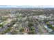 Panoramic aerial shot captures a neighborhood near community spaces, showcasing quiet streets and green landscape at 516 Spring Oaks Blvd, Altamonte Springs, FL 32714