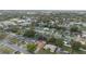 Wide angle aerial shot shows houses, streets, and a large school in the background at 516 Spring Oaks Blvd, Altamonte Springs, FL 32714