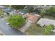 Aerial view of a single Gathering home with a brown roof and lush green landscaping at 516 Spring Oaks Blvd, Altamonte Springs, FL 32714