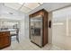 Bright kitchen with a stainless steel refrigerator, wooden cabinetry, and tile flooring at 516 Spring Oaks Blvd, Altamonte Springs, FL 32714