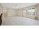 Open and airy living room with tile flooring and large windows at 516 Spring Oaks Blvd, Altamonte Springs, FL 32714