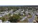 Expansive aerial view of a residential community featuring tree-lined streets and well-maintained homes with manicured lawns at 6106 Kittiwake Dr, Lakeland, FL 33809