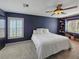 Comfortable bedroom with a large window, ceiling fan, and built in storage at 6106 Kittiwake Dr, Lakeland, FL 33809