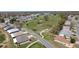 Aerial view of a golf course winding through a residential neighborhood, offering both recreation and scenic beauty at 6106 Kittiwake Dr, Lakeland, FL 33809