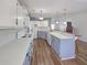 Open kitchen design with white countertops, two-tone cabinets and a view towards living area at 6106 Kittiwake Dr, Lakeland, FL 33809