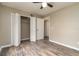 Bedroom featuring a ceiling fan, wood flooring, and closet with a convenient layout at 7266 Swallow Run # 7266, Winter Park, FL 32792