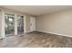 Bright living room with wood flooring, sliding glass door and neutral color palette at 7266 Swallow Run # 7266, Winter Park, FL 32792