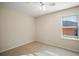 Bedroom featuring tile floors, a ceiling fan and a window bringing in natural light at 7528 Park Hill Ave, Leesburg, FL 34748