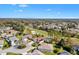 Breathtaking aerial view of a serene neighborhood nestled within a well-manicured golf course community at 7885 Se 166Th Hibernia Ln, The Villages, FL 32162