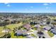 Picturesque aerial shot of a golf course community with lush green landscaping and beautiful homes at 7885 Se 166Th Hibernia Ln, The Villages, FL 32162