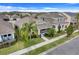 Aerial view of a well-kept home in a neighborhood with lush landscaping and manicured lawn at 909 Egrets Landing Way, Groveland, FL 34736