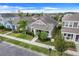 Aerial view of a well-maintained single-Gathering home with lush lawn and landscaped yard at 909 Egrets Landing Way, Groveland, FL 34736