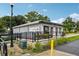 Exterior view of a corner cafe with a wheelchair ramp and clearly marked entrance at 909 Egrets Landing Way, Groveland, FL 34736