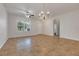 Open living room featuring tile floors, a ceiling fan, and natural light at 909 Egrets Landing Way, Groveland, FL 34736