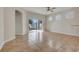 A living room area with sliding glass doors leading to the backyard at 909 Egrets Landing Way, Groveland, FL 34736