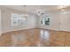 Bright living room featuring tile floors, a ceiling fan, and lots of natural light at 909 Egrets Landing Way, Groveland, FL 34736