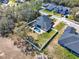 Aerial view of a home with a large yard, pool and lush lawn at 9513 Mid Summer Ln, Leesburg, FL 34788