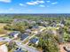 Aerial view of the community featuring homesites among natural landscapes and winding streets at 9513 Mid Summer Ln, Leesburg, FL 34788