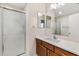 Bathroom with a white countertop and a glass door shower at 993 Davit Pl, The Villages, FL 32162