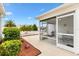 Screened-in patio with a view of the well-manicured backyard at 993 Davit Pl, The Villages, FL 32162