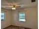 Bedroom featuring neutral walls, carpet, a ceiling fan, and windows offering plenty of natural light at 1009 Linda Glen Ave, Fruitland Park, FL 34731