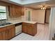 Functional kitchen featuring ample counter space, white appliances, and access to the dining area at 1009 Linda Glen Ave, Fruitland Park, FL 34731