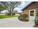 Exterior shot of a home with a spacious driveway and landscaping, enhancing curb appeal at 10122 Canterbury Dr, Leesburg, FL 34788