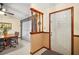 Bright foyer with decorative column and a view to the dining room at 10122 Canterbury Dr, Leesburg, FL 34788