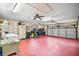 Spacious garage with ample room for vehicles and storage, complete with laundry facilities at 10122 Canterbury Dr, Leesburg, FL 34788