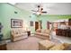 Comfortable living room featuring carpeted floors and seamless access to the kitchen area at 10122 Canterbury Dr, Leesburg, FL 34788