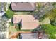 Bird's eye view of a home with a well-maintained lawn, lush landscaping, and proximity to other houses at 112 Flame Vine Way, Groveland, FL 34736