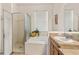 Bathroom featuring a stand alone bath tub, walk in shower and single sink vanity at 112 Flame Vine Way, Groveland, FL 34736