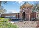 Community entrance with the 'Trilogy' sign and manicured landscaping at 112 Flame Vine Way, Groveland, FL 34736