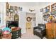 Spacious office area featuring a leather chair, vintage decor, and an adjacent bonus room at 112 Flame Vine Way, Groveland, FL 34736