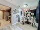 Dining area with an open layout to the kitchen, featuring a stylish table setting at 1131 Apple Ter, Leesburg, FL 34748