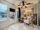 Sunroom featuring large windows, natural light, and stylish seating for a relaxing indoor-outdoor experience at 1131 Apple Ter, Leesburg, FL 34748