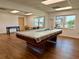 Spacious game room featuring a pool table and a foosball table at 1131 Apple Ter, Leesburg, FL 34748