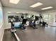 Well-equipped gym with treadmills, bikes, rowing machine, and weightlifting equipment at 1131 Apple Ter, Leesburg, FL 34748