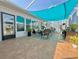 Relaxing screened lanai with comfortable seating, tile floors, and serene outdoor views at 1131 Apple Ter, Leesburg, FL 34748