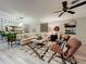Inviting living room with plush seating, stylish decor, and an open layout for modern living and entertaining at 1131 Apple Ter, Leesburg, FL 34748