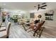 Comfortable living room boasts ample seating, decorative accents, and an open layout for easy entertaining at 1131 Apple Ter, Leesburg, FL 34748